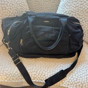 Tumi Black Duffel Bag with Gold Accents